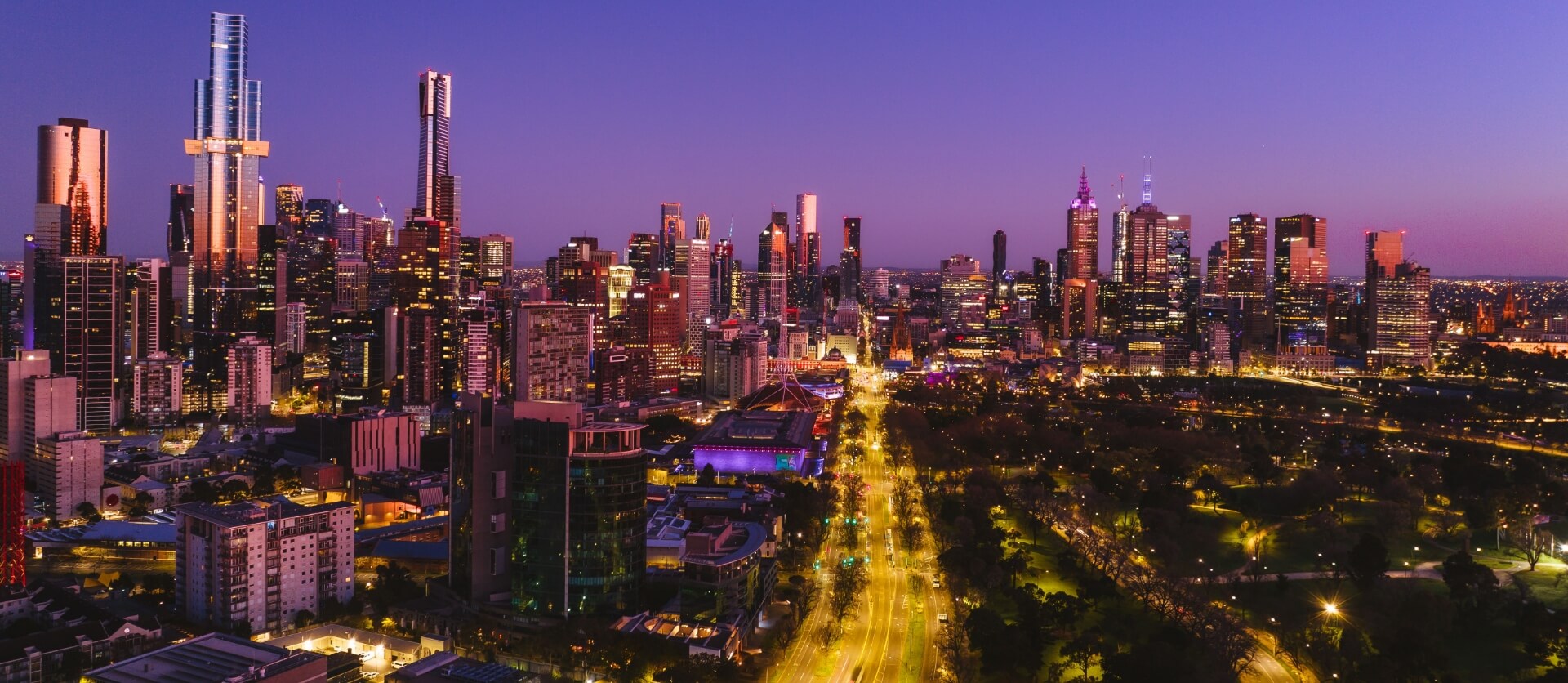 A stunning aerial shot of Melbourne's skyline at twilight, showcasing the city's vibrant energy and modern architecture.